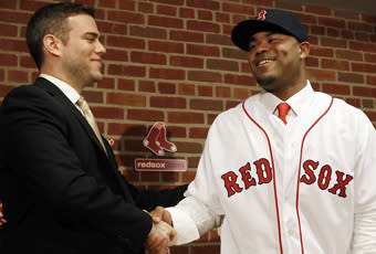 Theo Epstein shakes hands with Carl Crawford after the outfielder's free-agent contract was announced in December