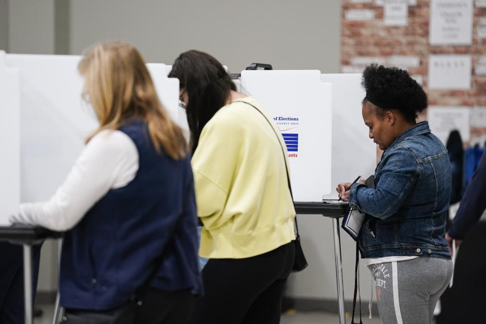 A person votes during Election Day, Tuesday, Nov. 7, 2023, at New Life Temple Church in Cincinnati. Polls are open in a few states for off-year elections that could give hints of voter sentiment ahead of next year's critical presidential contest. (AP Photo/Joshua A. Bickel)