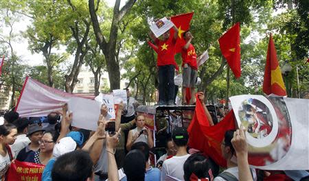 Protesters gather outside the Chinese embassy during an anti-China protest in Hanoi May 11, 2014. About 200 people took part in the protest on Sunday against maritime territorial disputes with neighbouring China, a Reuters reporter said. REUTERS/Kham