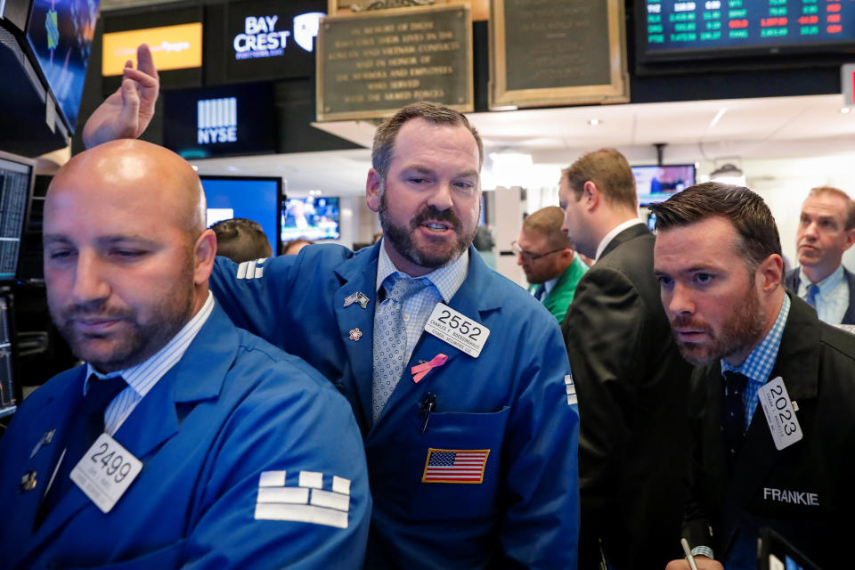 Traders work on the floor of the New York Stock Exchange (NYSE) in New York, U.S., September 21, 2018. REUTERS/Brendan McDermid