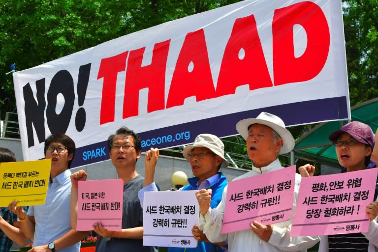 Anti-war activists protest against the planned deployment of the Terminal High Altitude Area Defense (THAAD) system outside South Korea's defence ministry in Seoul on July 8, 2016