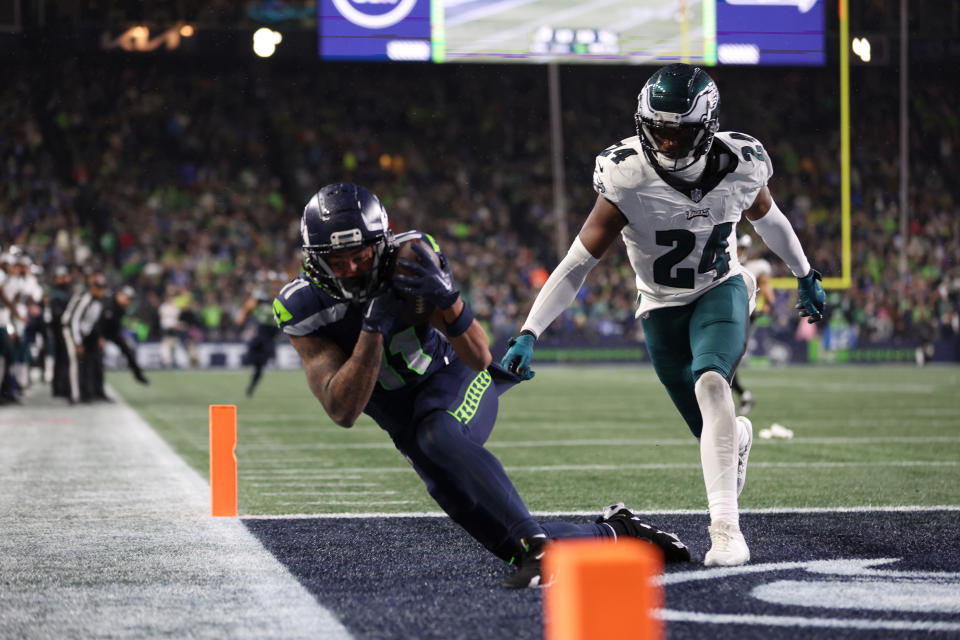 SEATTLE, WASHINGTON – DECEMBER 18: Jaxon Smith-Njigba #11 of the Seattle Seahawks catches a pass for a touchdown passed <a class="link " href="https://sports.yahoo.com/nfl/players/29296" data-i13n="sec:content-canvas;subsec:anchor_text;elm:context_link" data-ylk="slk:James Bradberry;sec:content-canvas;subsec:anchor_text;elm:context_link;itc:0">James Bradberry</a> #24 of the Philadelphia Eagles in the fourth quarter at Lumen Field on December 18, 2023 in Seattle, Washington. (Photo by Steph Chambers/Getty Images)