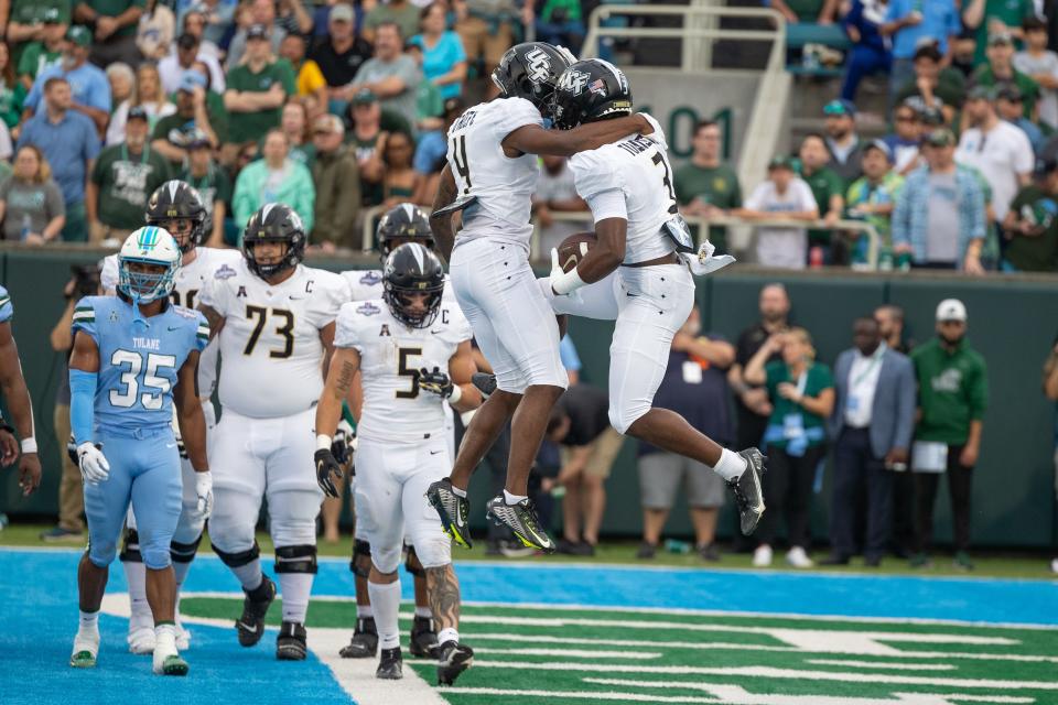 Dec 3, 2022; New Orleans, Louisiana, USA; UCF Knights wide receiver Xavier Townsend (3) celebrates scoring a touchdown against the Tulane Green Wave during the first half  at Yulman Stadium. Mandatory Credit: Stephen Lew-USA TODAY Sports