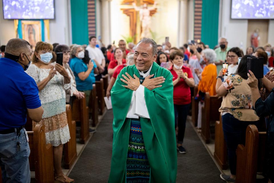 Monsignor Arturo J. Bañuelas walks down the nave and says thanks you and goodbye to parishioners after giving his last Mass of as pastor at Saint Mark’s Catholic Church, in El Paso, Texas, Sunday, July 10, 2022. After 46 years of serving the frontera community, Bañuelas, who has two PhDs in Theology, is retiring this month.