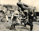 RAF Spitfire Fighter Pilots scramble to get airborne.