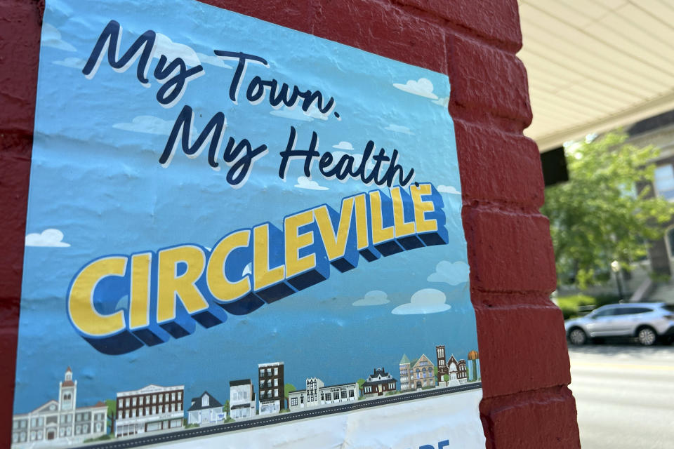 A mural in Circleville, Ohio reads "My town. My Health. Circleville," on August 3, 2023. In July, the K-9 program at the Circleville Police Department found itself under much greater scrutiny after police body and dash cameras recorded an officer's Belgian Malinois attacking a Black, kneeling trucker as he was surrendering alongside a highway with his hands up. (AP Photo/Patrick Orsagos)