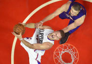 FILE - Los Angeles Clippers forward Blake Griffin, left, is fouled by Phoenix Suns center Alex Len, of Ukraine, as he shoots during the second half of an NBA basketball game, Monday, Oct. 31, 2016, in Los Angeles. Griffin announced his retirement Tuesday, April 16, 2024, after a 14-year career that included six All-Star selections, Rookie of the Year honors and a dunk contest victory. (AP Photo/Mark J. Terrill, FIle)