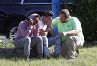 <p>People gather across the street from the scene of a shooting at a business park in the Edgewood area of Harford County, Md., Wednesday, Oct. 18, 2017. (Photo: Patrick Semansky/AP) </p>