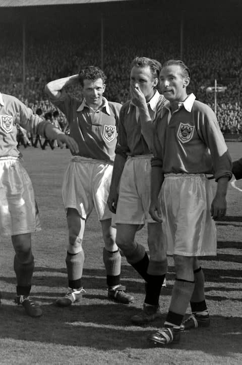 Robinson, left, waits to ascend to the Royal Box, with Stanley Matthews, right  - Credit: Colorsport/REX