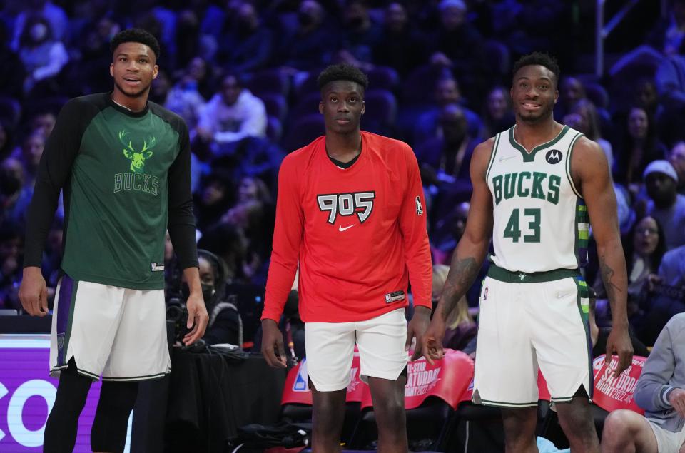 Feb 19, 2022; Cleveland, OH, USA; Team Antetokounmpo player Giannis Antetokounmpo (34), Team Antetokounmpo player Alex Antetokounmpo (29) and Team Antetokounmpo player Thanasis Antetokounmpo (43) look on during the Skills Challenge during the 2022 NBA All-Star Saturday Night at Rocket Mortgage Field House. Mandatory Credit: Kyle Terada-USA TODAY Sports