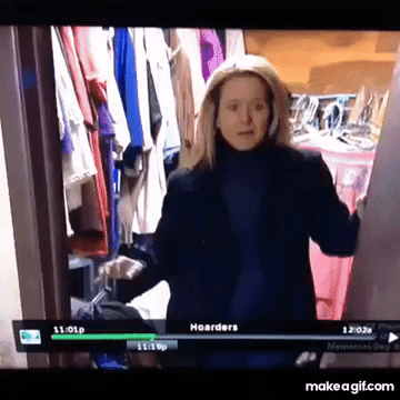 Woman grimacing in a cluttered room from the TV show "Hoarders"