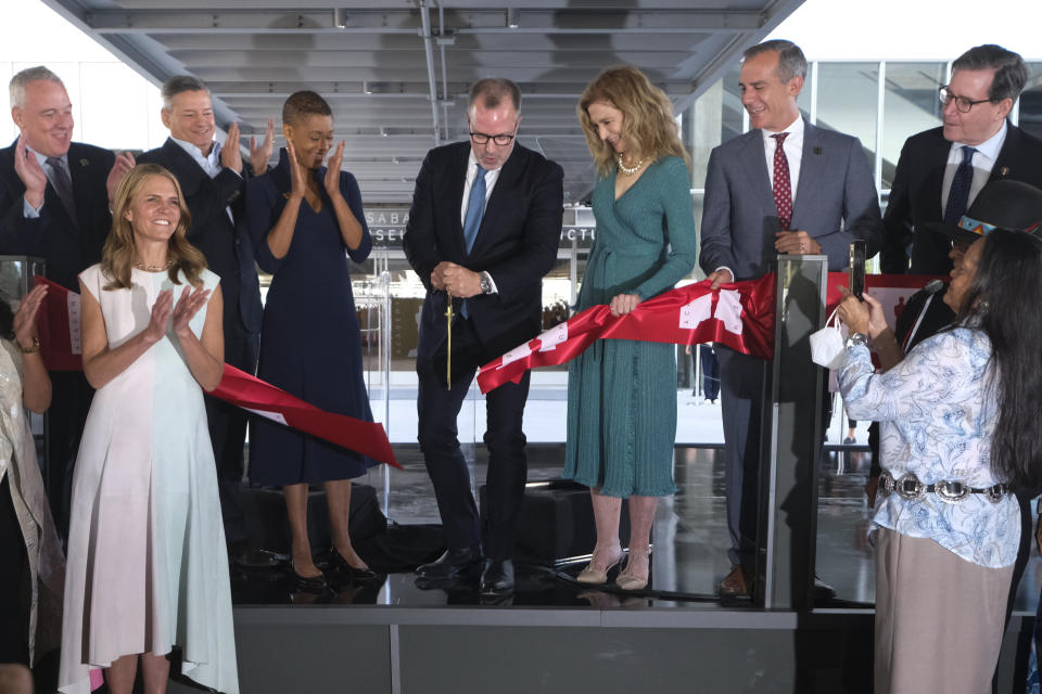 Ted Sarandos, Jacqueline Stewart, Bill Kramer, Dawn Hudson, Eric Garcetti, David Rubin, Effie T. Brown, Nithya Raman, Colleen Bell, Jimi Castillo,, and Virginia Carmelo at the official ribbon cutting for the opening of the Academy Museum of Motion Pictures on September 30, 2021 in Los Angeles - Credit: Ringo Chiu via AP