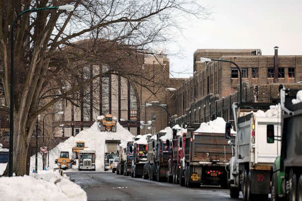 PHOTO: Trucks line up to drop off snow in front of Central Terminal following a winter storm in Buffalo, New York, Dec. 28, 2022. (Lindsay Dedario/Reuters)
