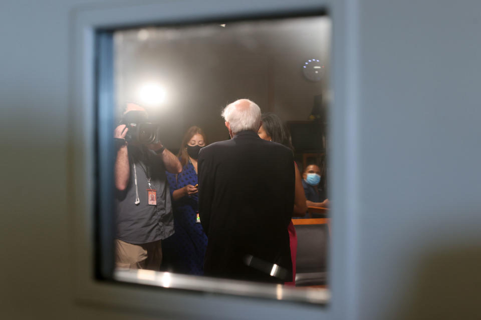 Sanders takes time for a television interview between votes on the Senate floor prior to passage of a $1 trillion bipartisan infrastructure bill on Aug. 10.<span class="copyright">Jonathan Ernst—Reuters</span>