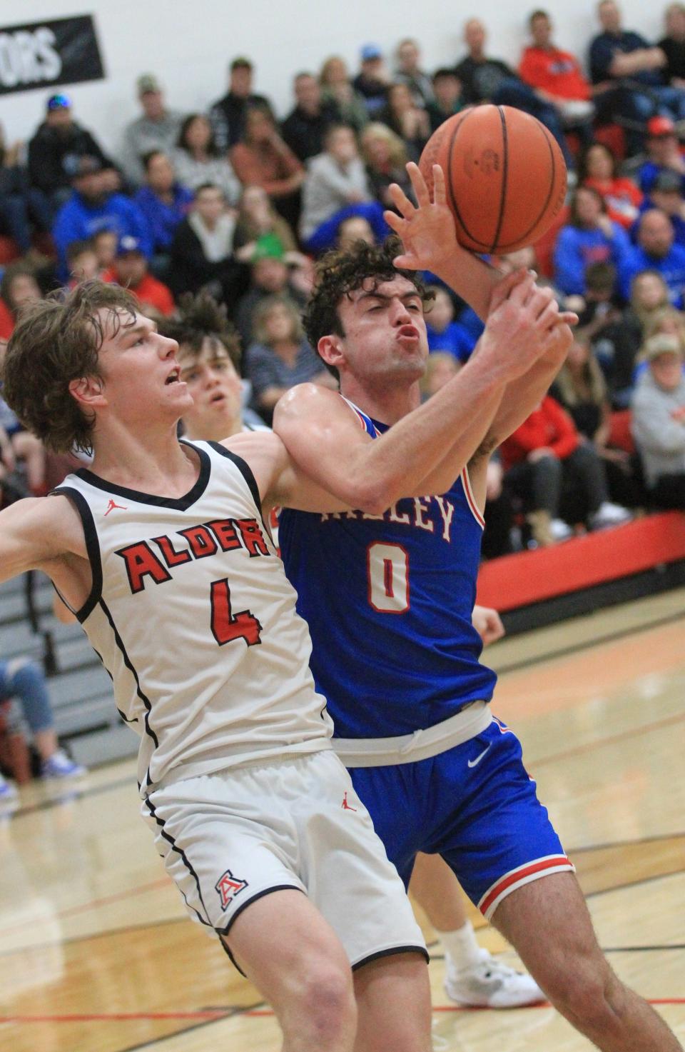 Peyton Heiss, left, scored 31 points on Saturday to lead Jonathan Alder to its first district title since 1979.