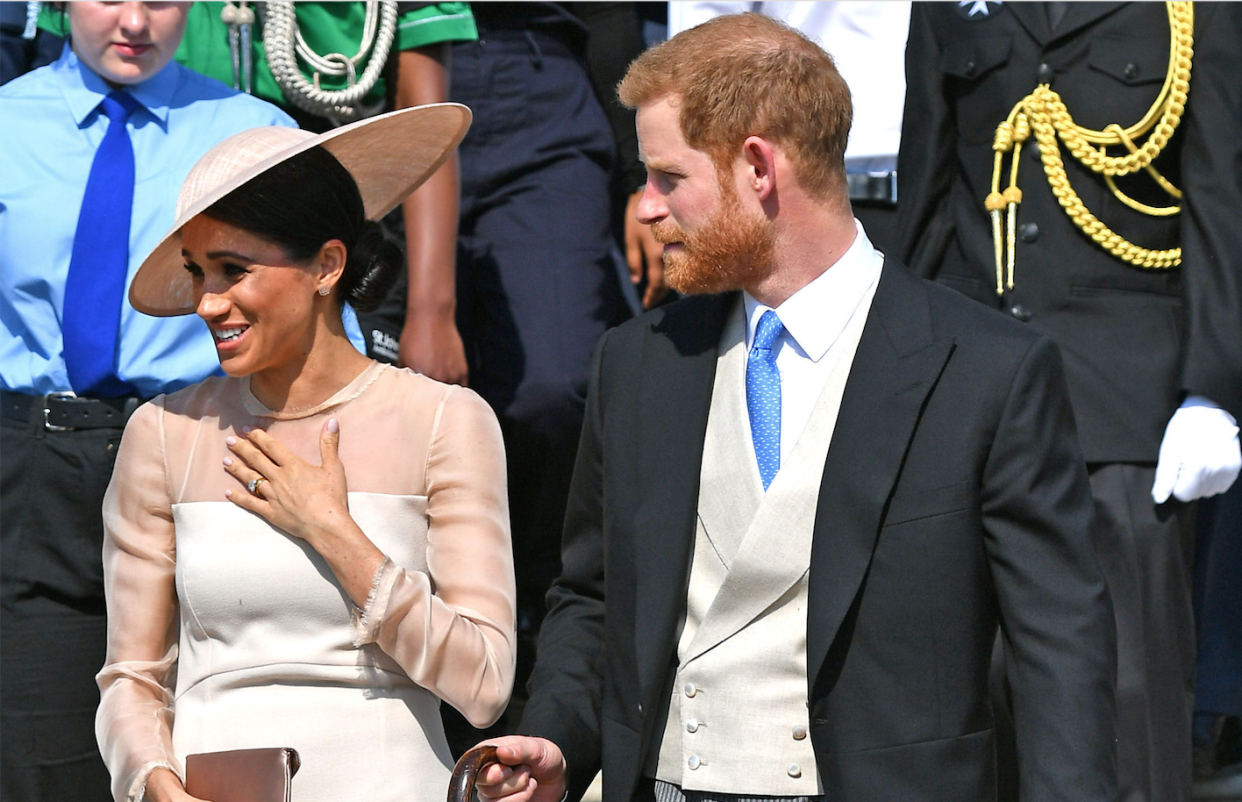 The Duke and Duchess of Sussex step out for their first royal engagement – a garden party for Prince Charles’ birthday. [Photo: Getty]