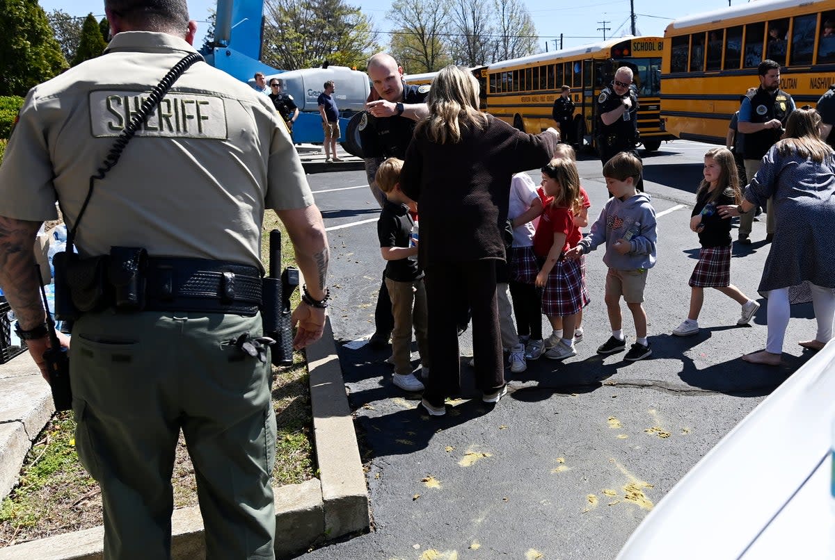 Students from The Covenant School get off a bus to meet their parents at the reunification site at the Woodmont Baptist Church (AP)