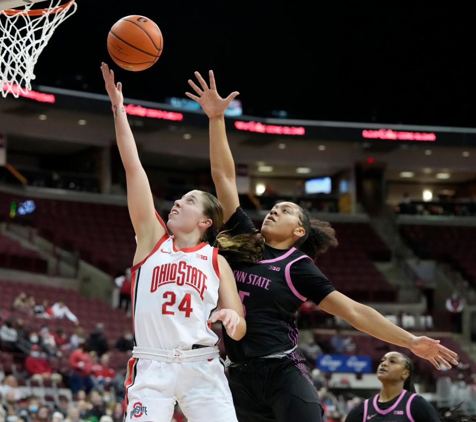 Ohio State Buckeyes guard Taylor Mikesell (24) is guarded by Penn State Nittany Lions guard Leilani Kapinus (5) during Thursday's NCAA Division I women's basketball game on February 24, 2022, at Value City Arena in Columbus, Oh.