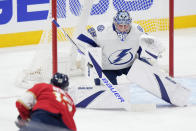 Florida Panthers center Sam Reinhart (13) attempts a shot at Tampa Bay Lightning goaltender Andrei Vasilevskiy (88) during the first period of Game 1 of the first-round of an NHL Stanley Cup Playoff series, Sunday, April 21, 2024, in Sunrise, Fla. (AP Photo/Wilfredo Lee)