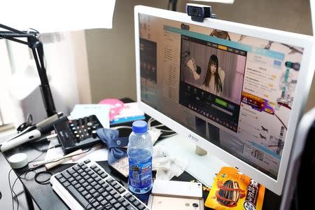 A girl broadcasts at Three Minute TV, a live streaming talent agency in Beijing, China, February 15, 2017. Picture taken February 15, 2017. REUTERS/Thomas Peter