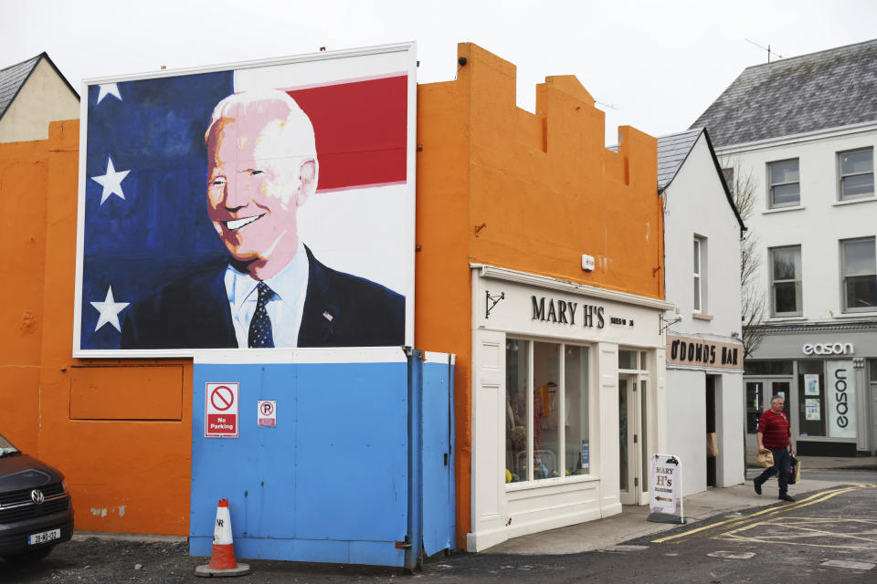 A mural of President Joe Biden adorns the side of a shop in Ballina, Ireland, Tuesday, April, 4, 2023. Excitement is building in Ballina, a small Irish town that was home to some of President Joe Biden's ancestors. Biden is scheduled to visit the town next week, part of a four-day trip to Ireland and neighboring Northern Ireland. (AP Photo/Peter Morrison)