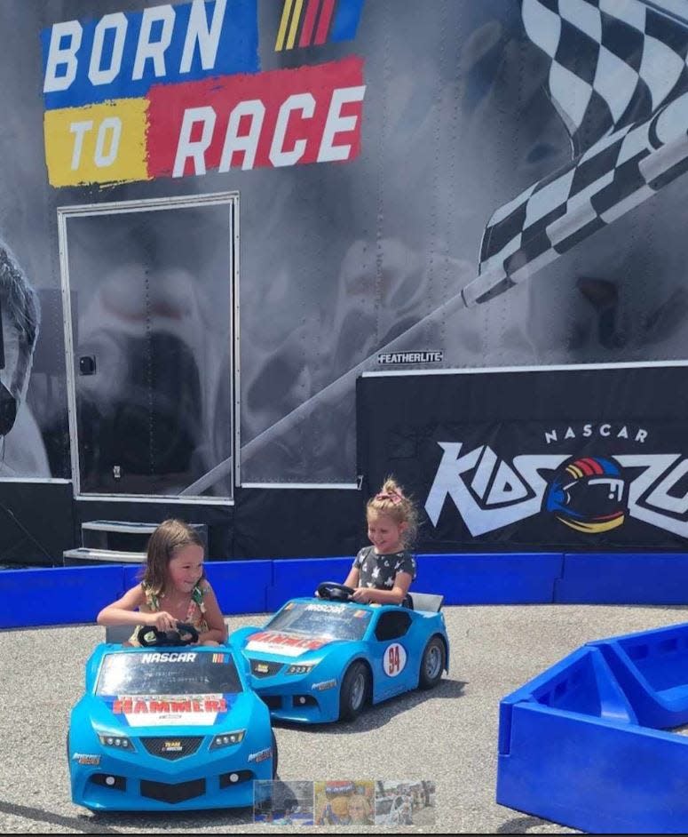 Evelyn Watts and Charlotte Rainville practice to be future NASCAR Cup Series stars in the Kid Zone at New Hampshire Motor Speedway.