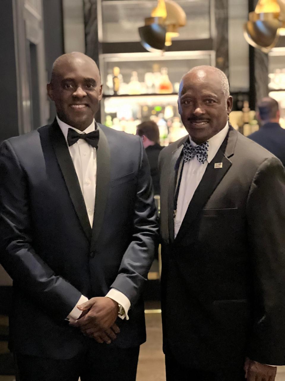 Florida Board of Governors Chair Brian Lamb takes a photo with his father, Tallahassee Community College's Board of Trustees chairman.