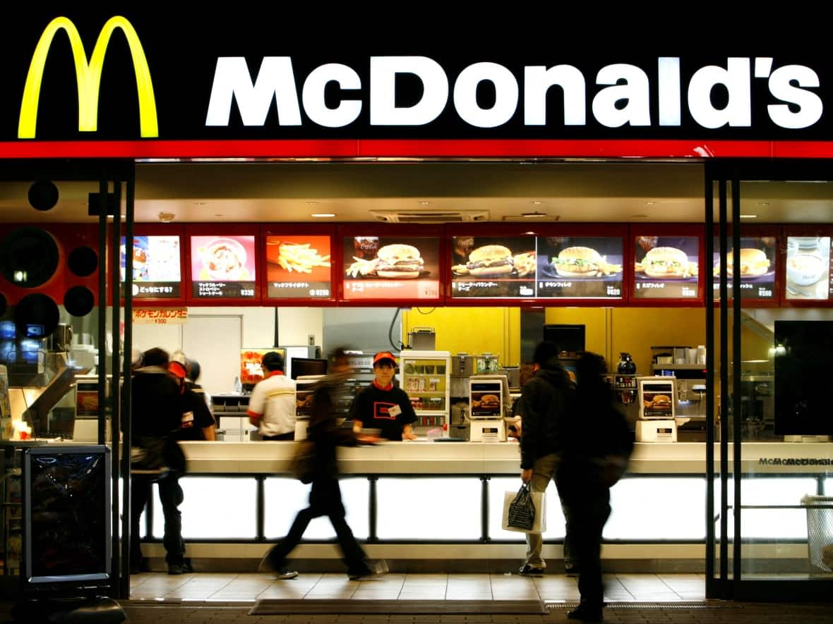 A McDonald's restaurant is seen in Tokyo. The company has announced it will pause selling medium and large-sized french fries as of this Friday.  (Reuters - image credit)