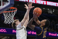 Notre Dame forward Tae Davis (13) shoots over Wake Forest forward Zach Keller (25) during the second half of the Atlantic Coast Conference second round NCAA college basketball tournament game Wednesday, March 13, 2024, in Washington. (AP Photo/Susan Walsh)