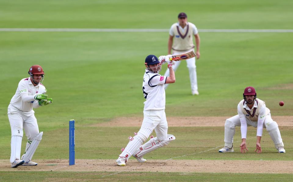 Dom Sibley of Warwickshire plays to the offside as Somerset wicketkeeper Steven Davies and Ben Green look on during day one of the LV= Insurance County Championship match between Warwickshire and Somerset at Edgbaston on September 21, 2021 in Birmingham, England. - GETTY IMAGES