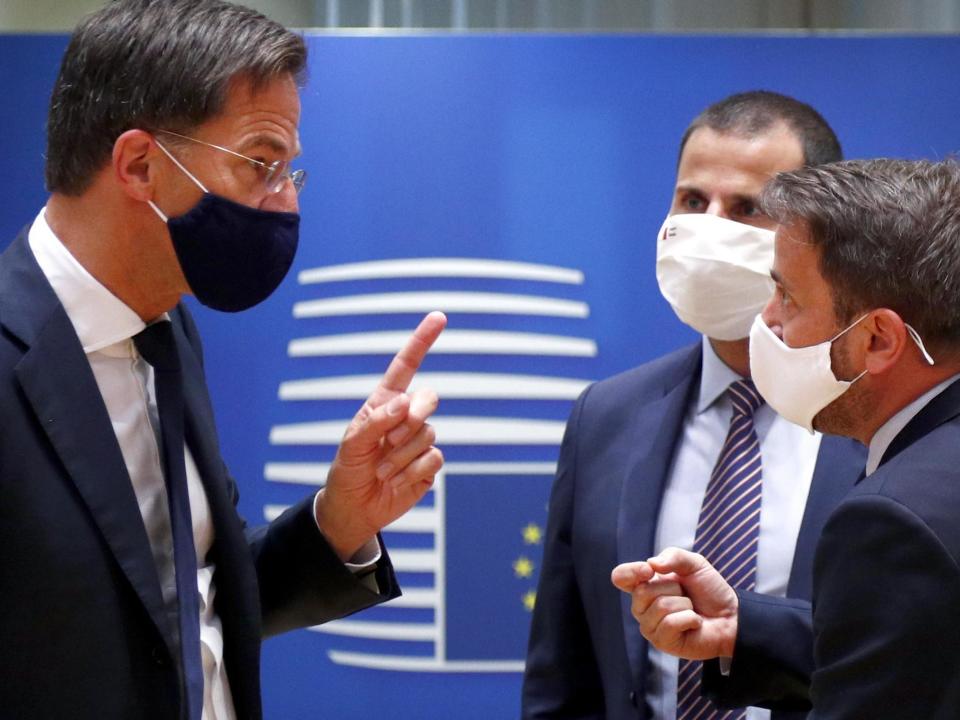 Dutch prime minister Mark Rutte (L) and Luxembourg's premier Xavier Bettel exchange words on Saturday: EPA