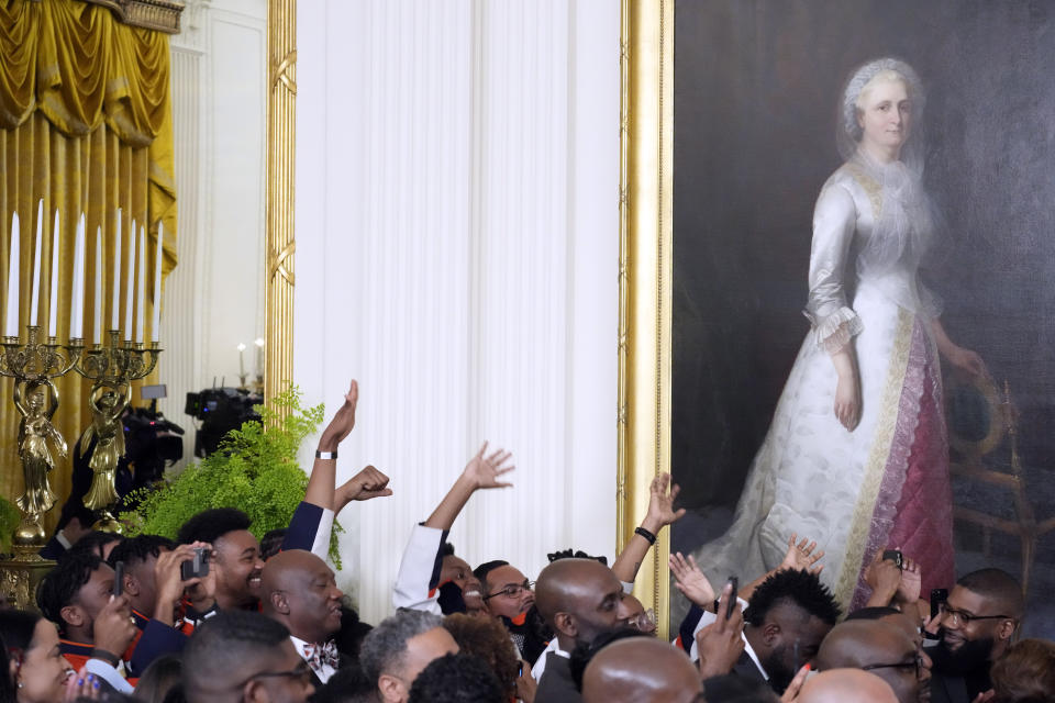 People listen as President Joe Biden speaks at an event to celebrate Black History Month, Monday, Feb. 27, 2023, in the East Room of the White House in Washington. (AP Photo/Alex Brandon)