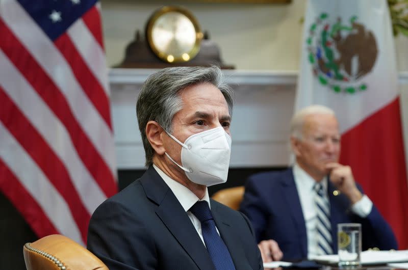 Blinken and Biden listen during a virtual meeting with Mexico President Andres Manuel Lopez from the White House in Washington