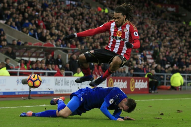 Leicester City's Christian Fuchs (bottom) vies with Sunderland's Jason Denayer at the Stadium of Light in Sunderland, north-east England on December 3, 2016