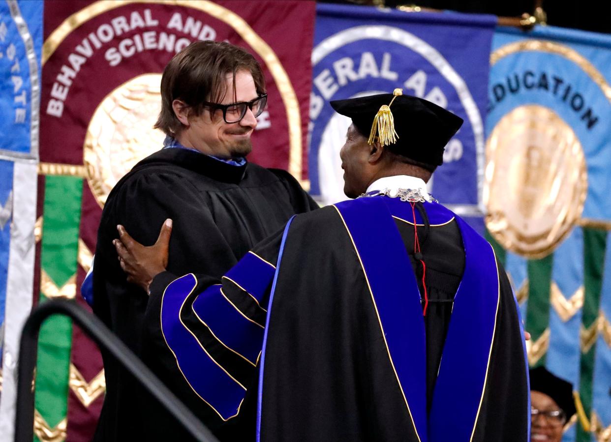 MTSU President Sidney McPhee speaks with Award winning singer songwriter and MTSU 2013 graduate Michael Hardy known professionally as HARDY after Hardy gave the Saturday afternoon address during MTSU’s 2024 Spring Commencement 2 p.m. ceremony at Murphy Center, on Saturday, May 4, 2024.