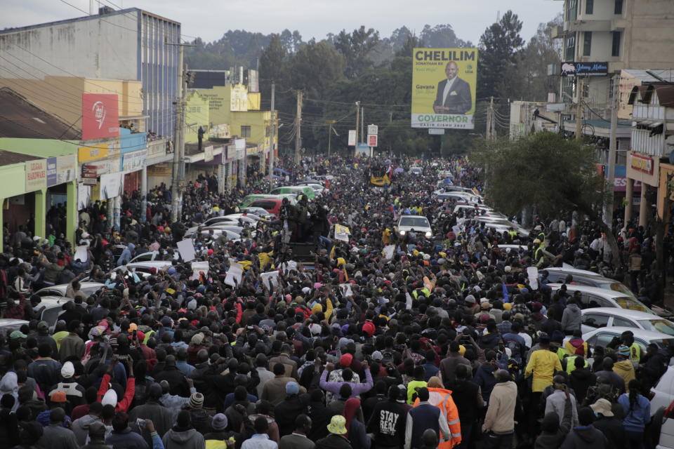 Supporters of Deputy President and presidential candidate William Ruto celebrate his victory over opposition leader Raila Odinga in Eldoret, Kenya, Monday, Aug. 15, 2022. Ruto received 50.49% of the vote, the chairman of the electoral commission said, while Odinga received 48.85%. (AP Photo/Brian Inganga)