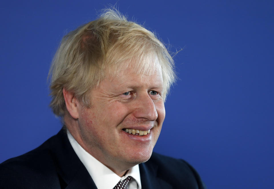 Britain's Prime Minister Boris Johnson smiles during a media conference in London, Friday, Nov. 29, 2019. Britain goes to the polls on Dec. 12. (AP Photo/Frank Augstein)