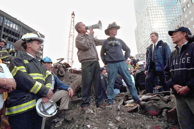 <p>Eric Draper/White House/Getty </p> President George W. Bush with Bob Beckwith at Ground Zero on Sept. 14, 2001