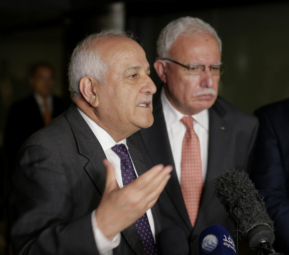 Palestinian ambassador to the United Nations Riyad Mansour, left, speaks to reporters while Palestinian minister of foreign affairs Riyad al-Maliki looks on following a meeting in New York, Wednesday, Sept. 26, 2018. (AP Photo/Seth Wenig)