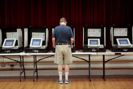 Bart Dekom casts his vote for Georgia's 6th Congressional District special election at Holy Cross Catholic Church in Tucker, Georgia, U.S., June 20, 2017. REUTERS/Chris Aluka Berry