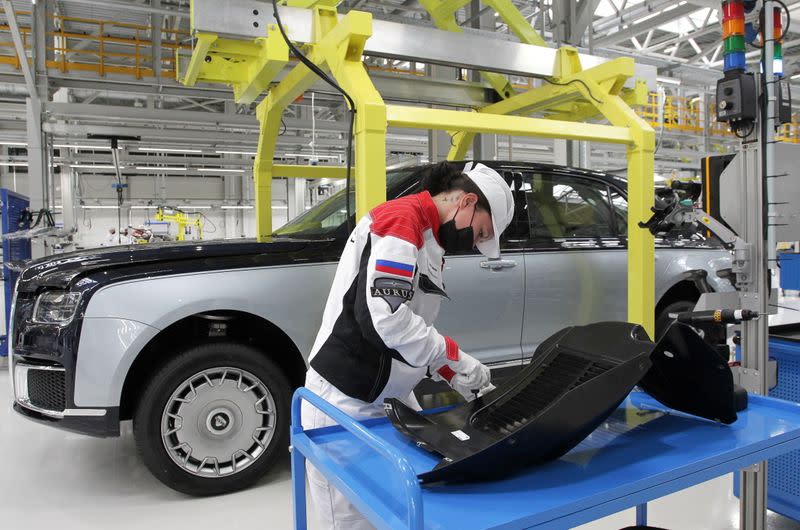 An employee works on an assembly line of the Aurus manufacturing plant in Yelabuga