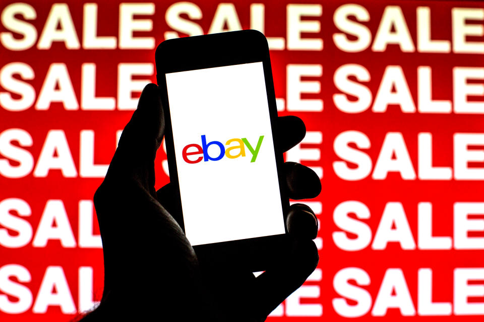 SPAIN - 2021/11/16: In this photo illustration, an eBay logo is seen on a smartphone screen with 'Sale' words in the background. (Photo Illustration by Thiago PrudÃªncio/SOPA Images/LightRocket via Getty Images)