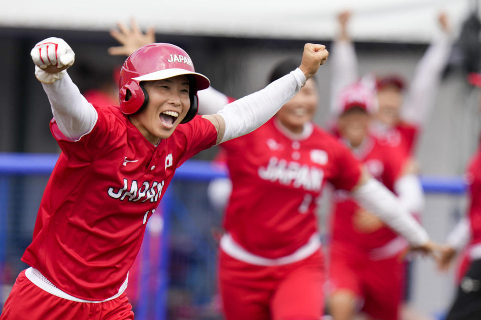 Japan's Eri Yamada celebrates their win over Mexico during their softball game at the 2020 Summer Olympics, Thursday, July 22, 2021, in Fukushima , Japan. (AP Photo/Jae C. Hong)