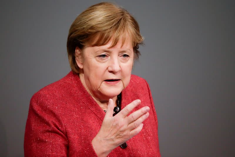 FILE PHOTO: German Chancellor Angela Merkel delivers a speech in parliament, in Berlin