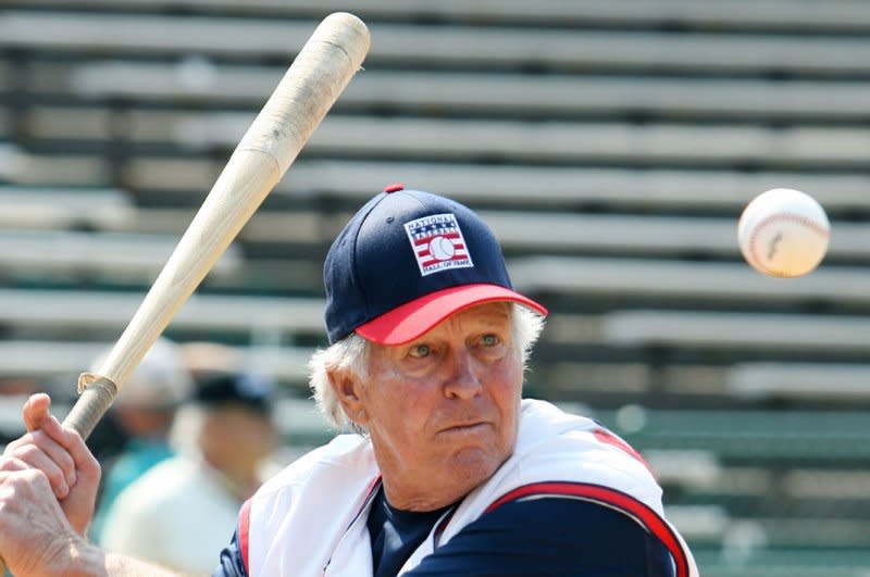 Brooks Robinson eyes the baseball as he hits at Doubleday Field in Cooperstown, N.Y., in July 2007. Robinson, the legendary third baseman who spent 23 seasons with the Orioles, has died. He was 86. File Photo by Bill Greenblatt/UPI