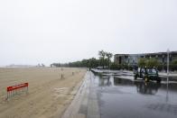 New York City Parks officials work at an empty Orchard Beach Saturday, May 23, 2020, in the Bronx borough of New York. Gov. Andrew Cuomo has given New Yorkers an unexpected reprieve from cabin fever by easing the state’s ban on gatherings due to coronavirus concerns, in time for the Memorial Day weekend. New York City beaches are open this weekend. But no swimming is allowed, and masks must be worn. (AP Photo/Frank Franklin II)