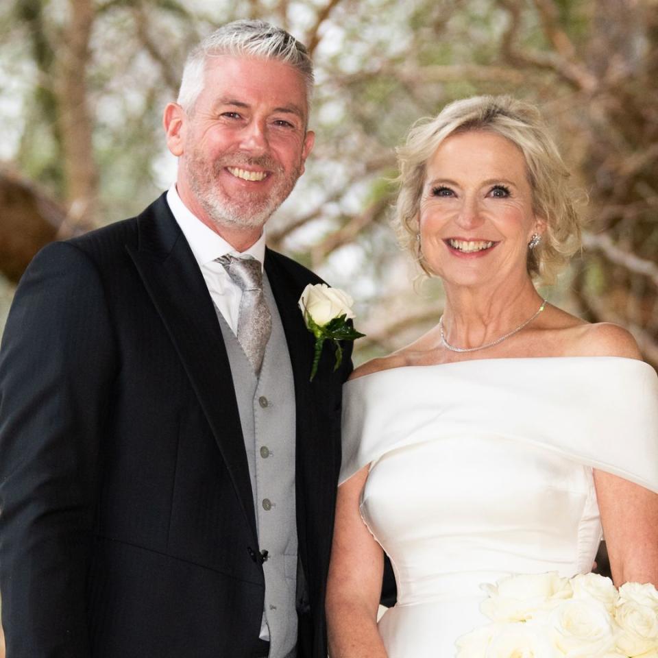 Carol Kirkwood is a beautiful bride in off-the-shoulder princess dress to wed partner Steve Randall