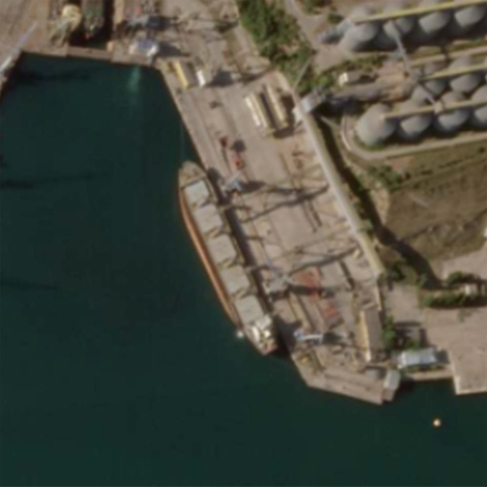 In this Planet Labs satellite image, the cargo ship Mikhail Nenashev is docked at the Russian-controlled Avlita Grain Terminal in Sevastopol, Crimea, on July 24, 2022. An Associated Press investigation shows the ship, owned by a sanctioned Russian state-owned defense contractor, is part of an extensive Russian-run smuggling operation that has been hauling stolen Ukrainian grain from ports in occupied Crimea to customers in the Middle East. (Planet Labs via AP)