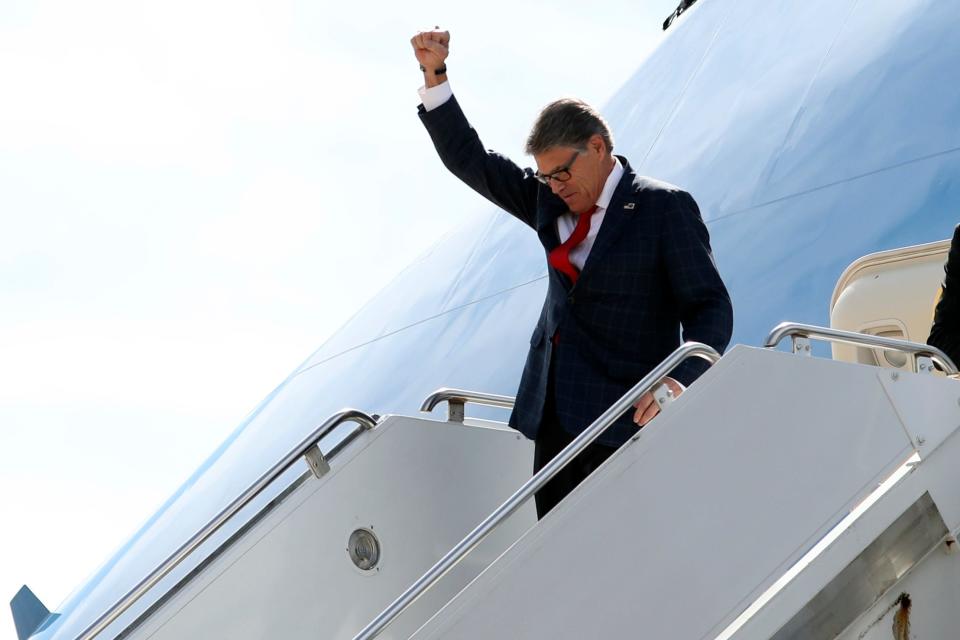 Energy Secretary Rick Perry gestures as he arrives on Air Force One with President Donald Trump at Naval Air Station Joint Reserve Base in Fort Worth, Texas, Thursday, Oct. 17, 2019. (AP Photo/Andrew Harnik) ORG XMIT: DCAH324