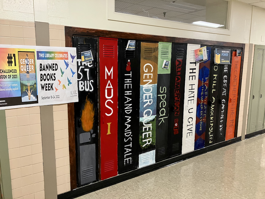 A mural of frequently banned books is painted on school lockers at Milford High School.